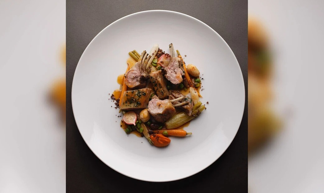 orange vegetables and food on white plate