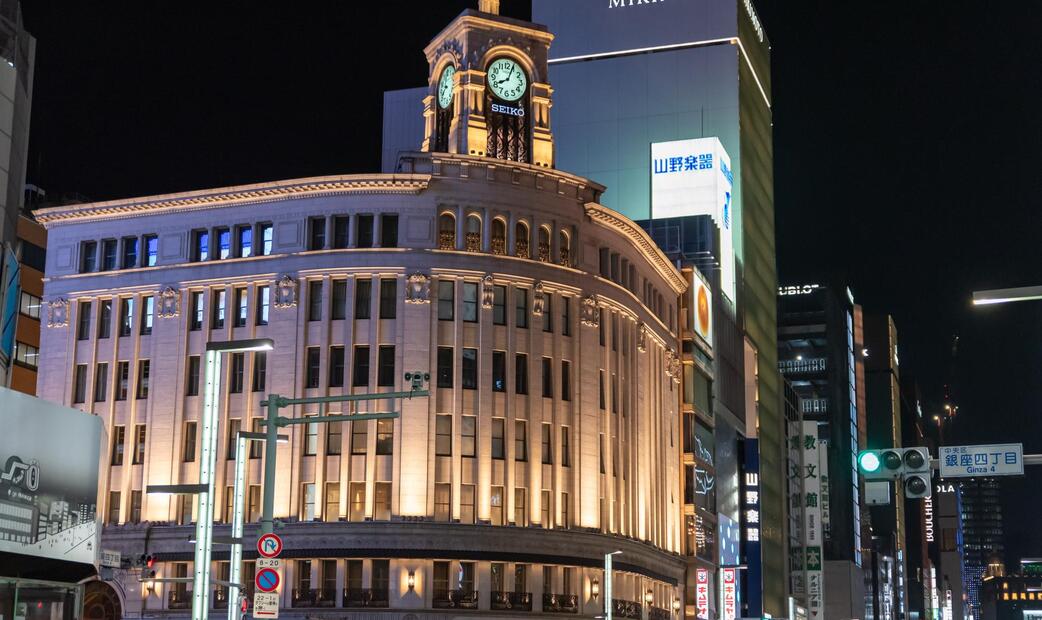 Night view of the Ginza Wako clock tower in Tokyo.