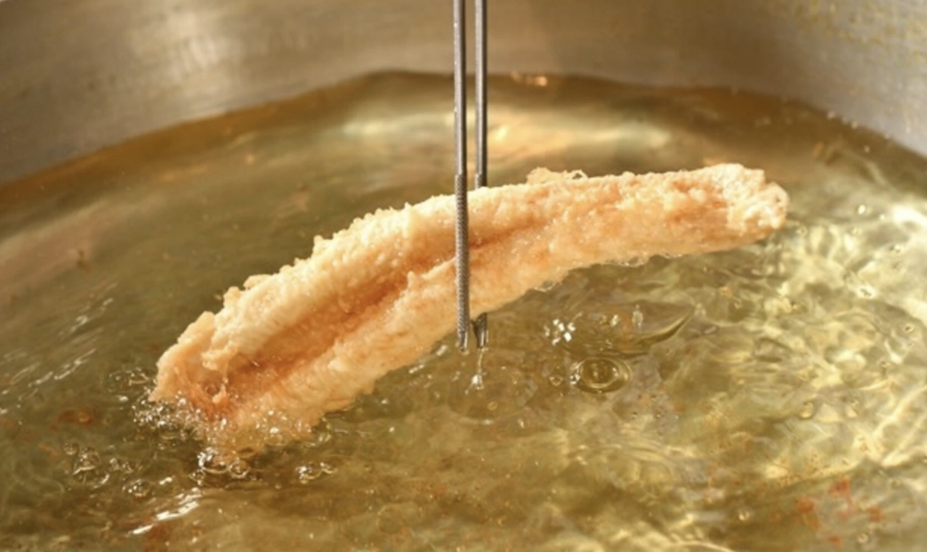 Anago (conger eel) being fried of Tempura Kiwa