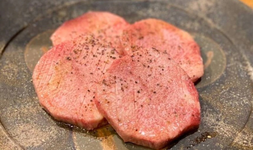 4 pieces of red meat on a plate