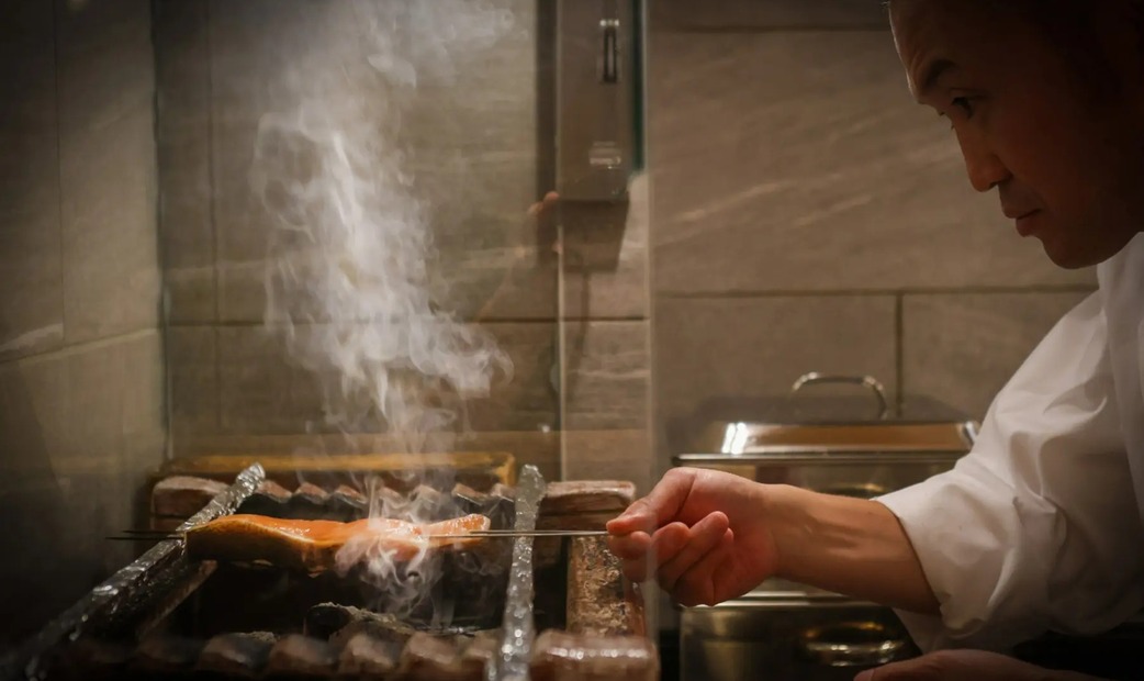 Chef grilling fish