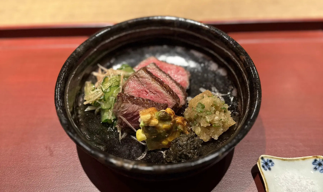 Red roast beef on black plate