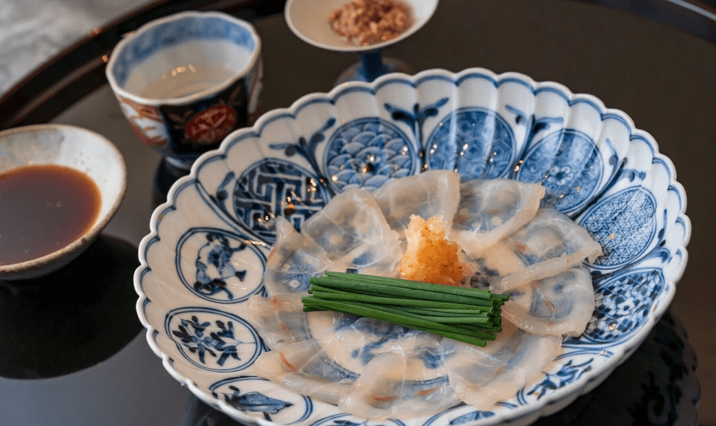 Sliced pufferfish sashimi on a plate