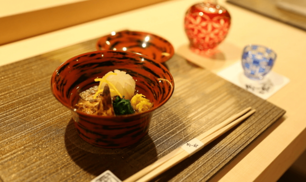 Japanese traditional soup in red bowl