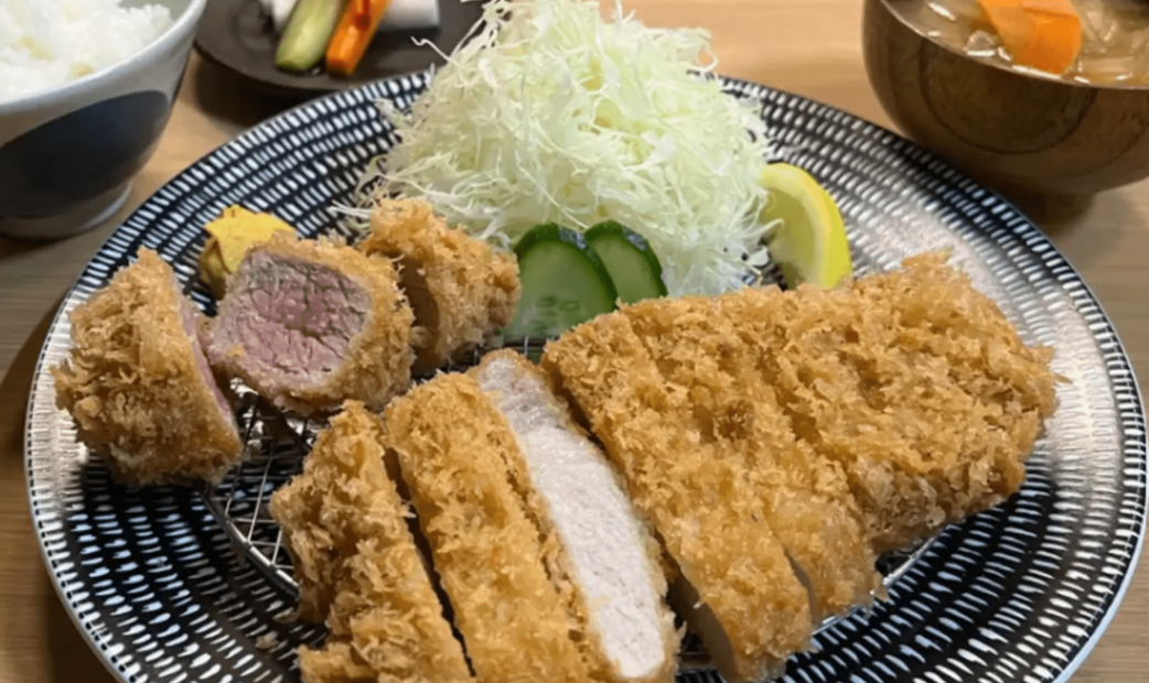 A Tonkatsu with sliced cabbage, rice, and miso-soup