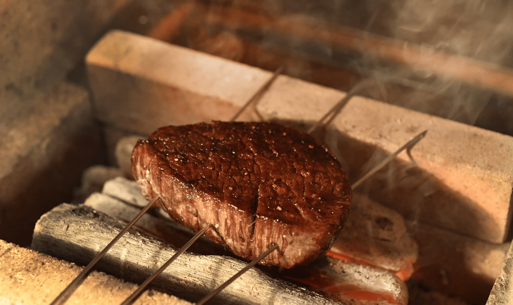  grilling meat on skewers