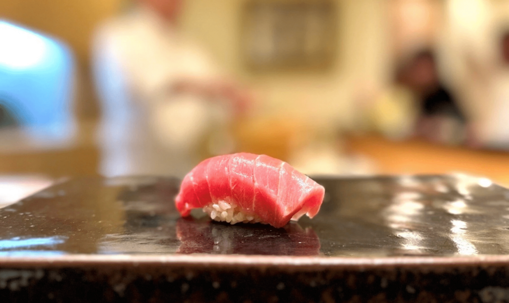 Tuna sushi on a black plate