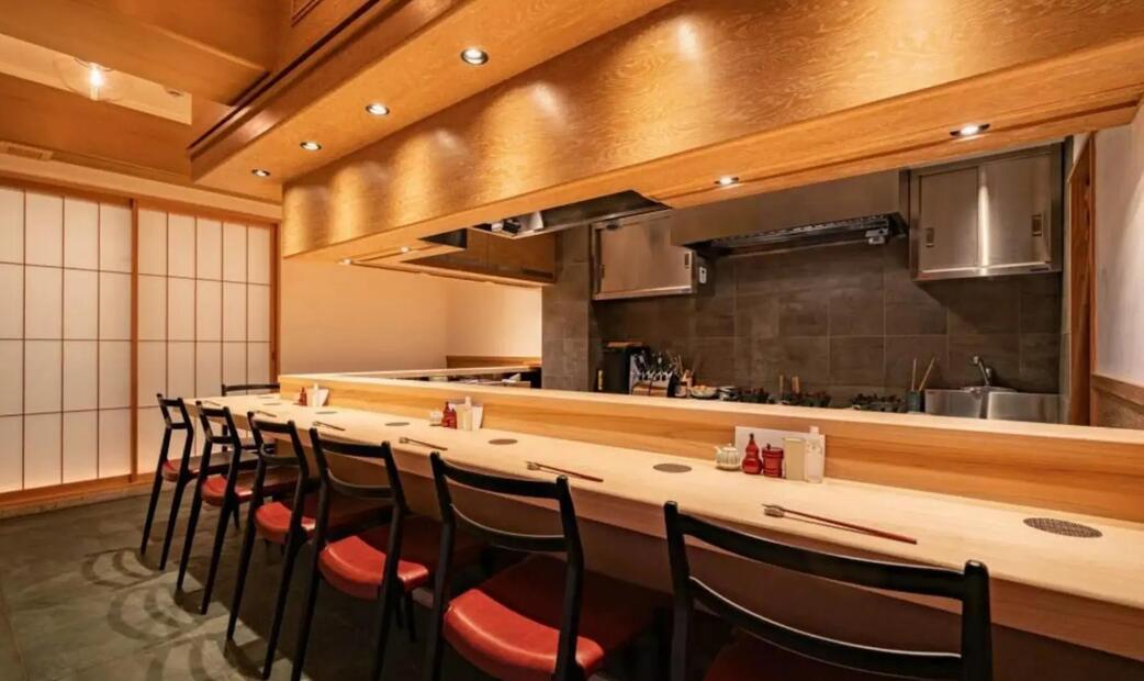 A cozy Japanese-style counter seating area with wooden decor.